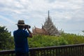 Man traveler and photographer is taking photo of Sanctuary of truth