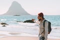 Man traveler relaxing on ocean beach enjoying landscape Royalty Free Stock Photo