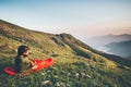 Man Traveler relaxing in sleeping bag camping