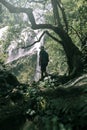 Man traveler is sightseeing at khlong lan waterfall in Kamphengphet Royalty Free Stock Photo