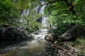 Man traveler is sightseeing at khlong lan waterfall in Kamphengphet Royalty Free Stock Photo