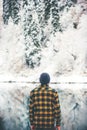 Man Traveler standing alone enjoy lake and forest