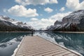 Man traveler standing on pier in Spirit Island on Maligne Lake at Jasper national park