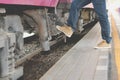 Man traveler stepping up train at railway station. backpacker tr Royalty Free Stock Photo