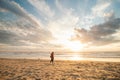 Man, a traveler watching a breathtaking sunset on the shores of the North Sea near Zandvoort, Netherlands