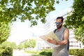 Man traveling with backpack and map in city Royalty Free Stock Photo