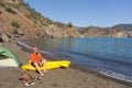 A man traveling by canoe along the coast Royalty Free Stock Photo