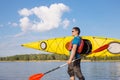 Man traveling on the river in a kayak . Royalty Free Stock Photo