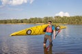 Man traveling on the river in a kayak . Royalty Free Stock Photo