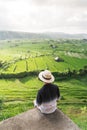 A man traveller sitting and looking to rice paddy in Bali island, Indonesia