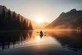 A man travelling in a kayak in a lake at sunrise in mountains is a peaceful and serene scene that captures the beauty