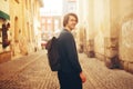 A man travels in Europe. A man smiles, walks through the streets of the old city, with a briefcase. Royalty Free Stock Photo