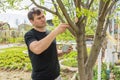 The man treats the sawed wood cut garden pitch at their summer cottage Royalty Free Stock Photo