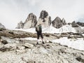 Man trekking in the Alps. Mountain ridge of Tre Cime