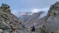 Man trekking on mystical hiking trail leading to Mount Olympus (Mytikas, Skala, Stefani) in Mt Olympus National Park