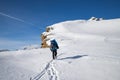 man trekking in snow in the Swiss Alps