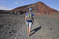 A man trekking in the volcanic Timanfaya national park Royalty Free Stock Photo