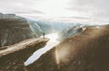 Man on Trolltunga cliff edge happy raised hands Royalty Free Stock Photo