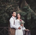 Man in trousers and a shirt, and a girl in a wedding dress