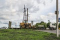 The MAN truck transports an SDLG excavator tractor. Royalty Free Stock Photo