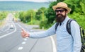 Man try stop car thumb up. Pick me up. Hitchhiking one of cheapest ways traveling. Picking up hitchhikers. Hitchhikers Royalty Free Stock Photo
