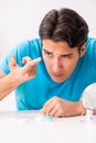 The man trying contact lenses at home Royalty Free Stock Photo