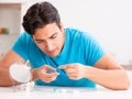 Man trying contact lenses at home Royalty Free Stock Photo