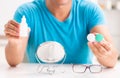 Man trying contact lenses at home Royalty Free Stock Photo
