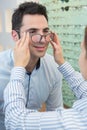 man trying on new eyeglasses with designer frames Royalty Free Stock Photo