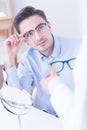 Man trying on new eyeglasses Royalty Free Stock Photo
