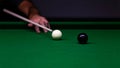 Man trying to hit the ball in billiard Royalty Free Stock Photo
