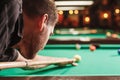 Man trying to hit the ball in billiard. Royalty Free Stock Photo