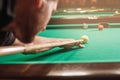 Man trying to hit the ball in billiard. Royalty Free Stock Photo