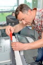 Man trying to repair office printer Royalty Free Stock Photo