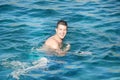 Man trying to swim butterfly in the sea Royalty Free Stock Photo