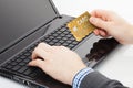 Man trying to use his golden credit card to pay for something online