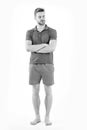 Man in tshirt and shorts barefoot isolated on white background. Bearded man with eyes closed in blue clothes. Macho in