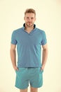 Man in tshirt and shorts on white background. Bearded man in blue casual clothes. Macho in active wear for