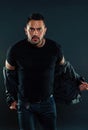 Man in tshirt undress leather jacket. Bearded man with serious face. Fashion macho in casual style clothes. Confidence Royalty Free Stock Photo