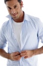 Man tucking his shirt buttons Royalty Free Stock Photo