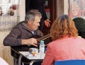 Man Tuning Guitar In Lagos Portugal Royalty Free Stock Photo