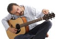 Man tuning his guitar Royalty Free Stock Photo