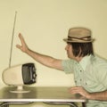 Man tuning in television. Royalty Free Stock Photo