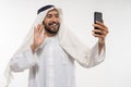 man in a turban using a mobile phone video conference and calling