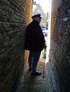 Man turning around at the end of an alley Royalty Free Stock Photo