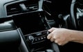 Man turning on car air conditioning system. Hand of man turning on car air conditioning system,Button on dashboard in car panel, Royalty Free Stock Photo