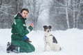 Two dogs walk outdoors in winter with an owner Royalty Free Stock Photo