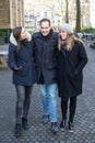 Man with two girls walking