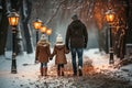 A man and two little girls walking in the snow