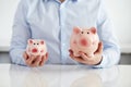 Man with two piggy banks Royalty Free Stock Photo